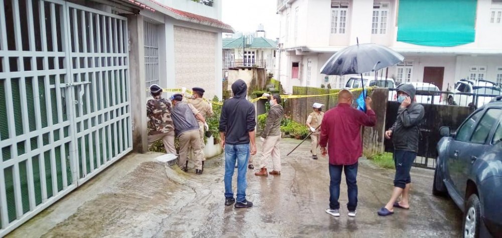 Police personnel marking off 'sealed areas' at Upper AG Colony in Kohima on July 12.
